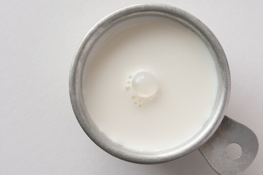 Half and Half Cream in a  Measuring Cup

