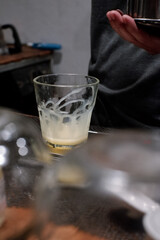 sweetened condensed milk in a glass cup