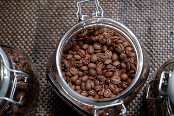 coffee in glass jar at barista table. top view
