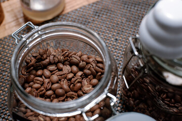 Fototapeta premium coffee in glass jar at barista table. top view