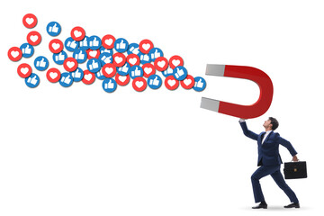 Businessman attracting likes with large magnet