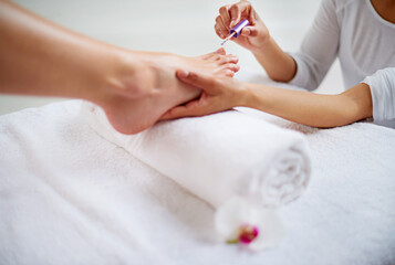 Obraz na płótnie Canvas Relaxing pedicure. Closeup shot of a woman getting a pedicure in a health spa.