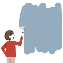 壁にペンキを塗る女性