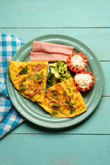 Ham omelette with avocado and tomato