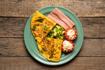 Ham omelette with avocado and tomato