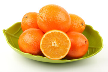 Whole orange fruit and  segments or cantles isolated on white background cutout