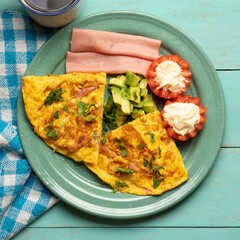 Ham omelette with avocado and tomato