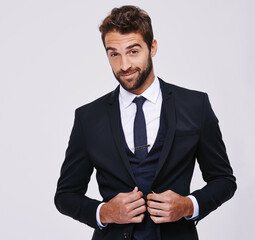 Handsome and successful. Studio shot of a well-dressed man against a gray background.