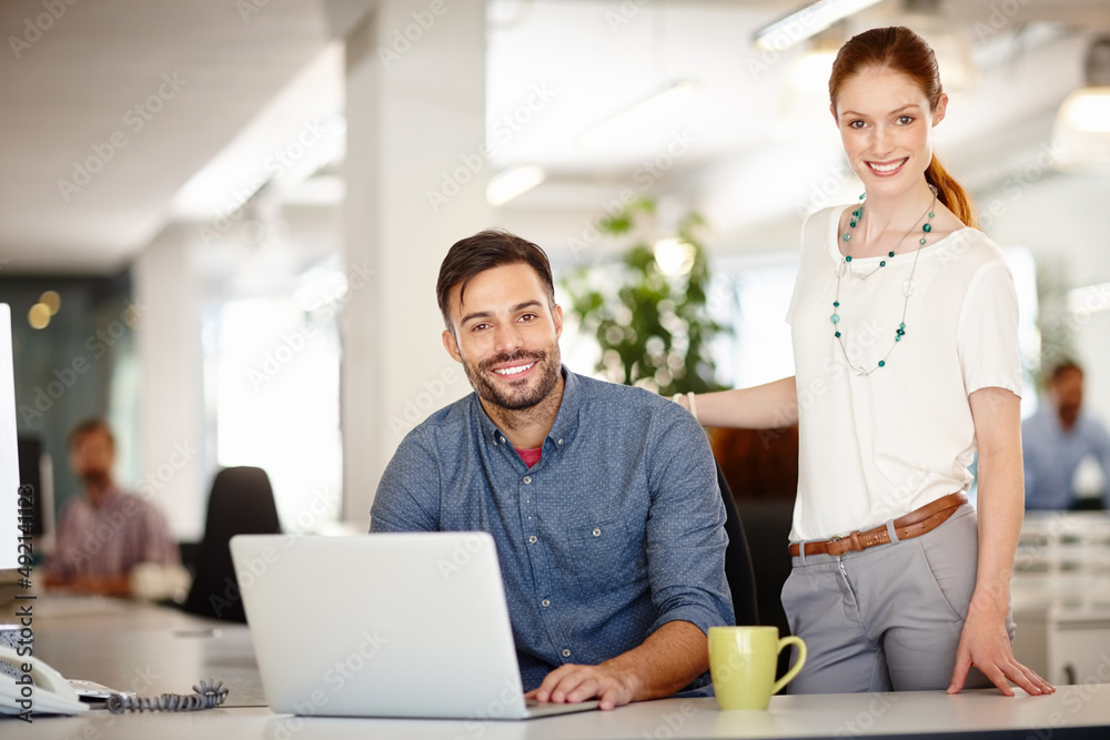 Poster were right on schedule with our deadlines. portrait of two colleagues working together in an office.
