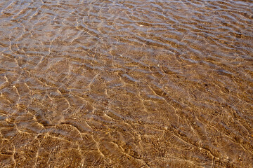 clear water in a lake with sand