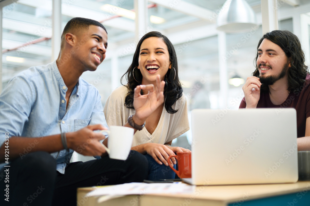 Poster Working with every exceptional idea of theirs. Shot of a group of businesspeople having a discussion in an office.