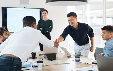 Bring on the best to be the best. Shot of businessmen shaking hands during a meeting in a modern office.