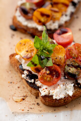 Sandwich with tomatoes, feta, basil and balsamic vinegar