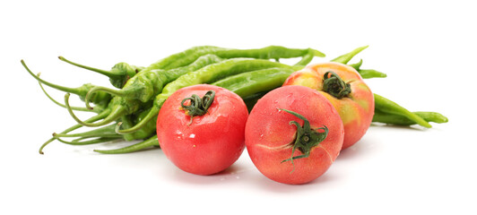Fototapeta na wymiar fresh tomato and green peppers isolated on white background