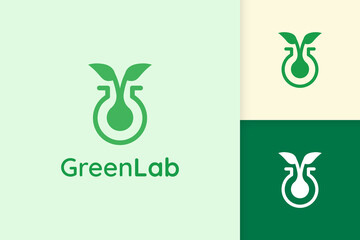 green lab logo with leaf shape for science or chemistry