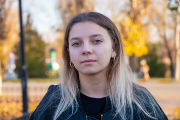 portrait of a beautiful European girl with loose hair against the background of nature. selective focus.