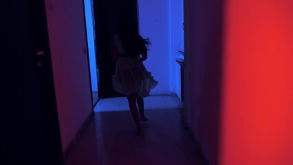 danger, fear - scared indian woman runs in the dark to escape an assault