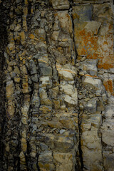 Dark stone background. Detail of the Dolomite rock. Vertical image.