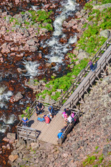 Tourists on a outlook platform at a river