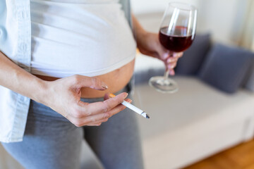 Smoking and alcohol pregnancy.woman on a long pregnancy drinking alcohol and Smoking...