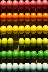 background from a children's toy abacus with multi-colored beads. abstraction.