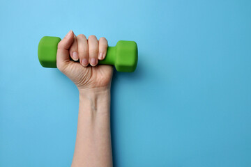hand with dumbbell