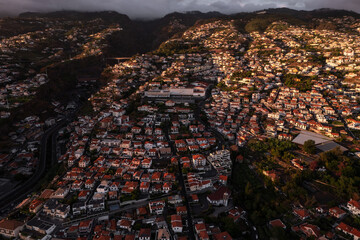 Fototapeta premium Landscape of city in mountains in evening