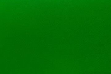 Green leather background texture close up 