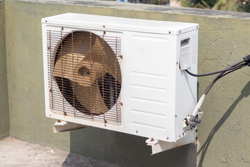 fan of an air conditioner connected on the roof. 
