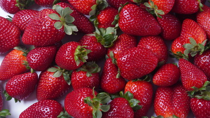 Strawberry fresh organic fruit. Strawberries with leaves on a white background.