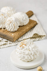meringue on a wood on white background