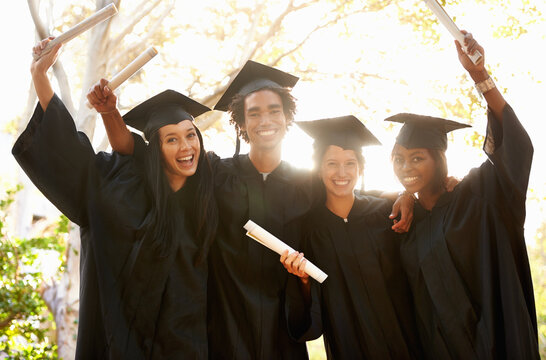 Positive Theyre Going Places. A Group Of Smiling College Graduates Celebrating Their Graduation.