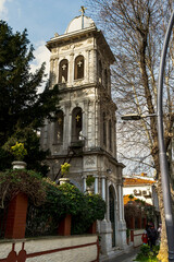 Fototapeta na wymiar belfry of the Hagios Georgios Greek Orthodox Church in Kuzguncuk District of Istanbul, Turkey. Camapanile or steeple.