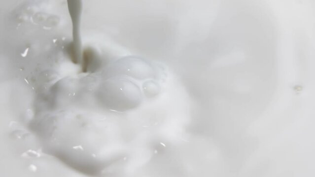Perfect purity and tenderness of the process of mixing milk for the preparation of dairy and cosmetic products. Advertising concept. Perfectly white and clean.