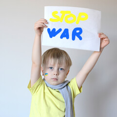 A child with the flag of Ukraine