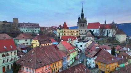 historic medieval town of Sighisoara, aerial view, famous tourist destination in Romania, scenic unesco heritage site in Transylvania in winter