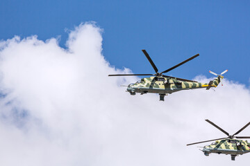 russian army helicopter in action against cloudy sky