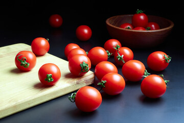 Cherry tomatoes on a dark surface