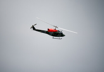British Army Air Corps ZJ969 Bell 212 helicopter banking hard conducting pilot training and...