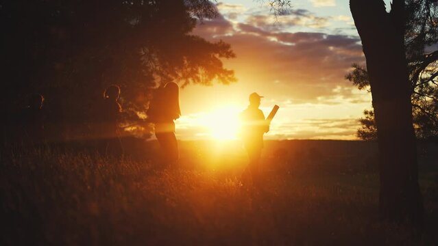 hiker group. team of hikers with backpacks silhouette walk through the forest. nature travel a adventure concept. hiker group with backpacks walk on the sunset. lifestyle mountain outdoor view