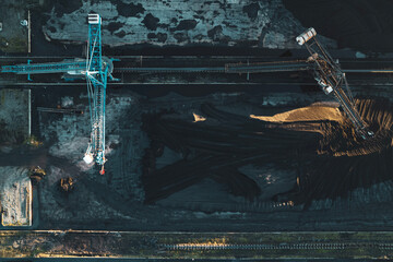 aerial shot of industrial cranes at refinery