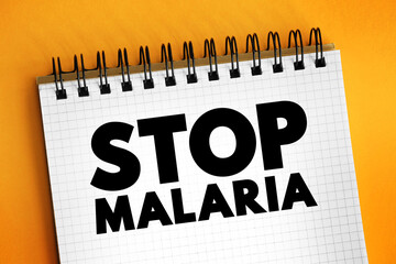 Stop Malaria text on notepad, medical concept background