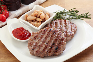 Grilled beef burger cutlet with sauce