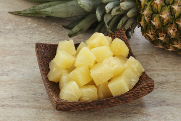 Marinated pineapple slices in the bowl