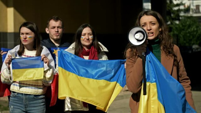 Protest against the war in Ukraine and the Russian invasion. People with flags at a demonstration in support of Ukraine.