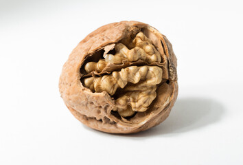 Walnuts are rounded, single-seeded stone fruits of the walnut tree. Cracking a nut.