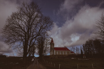 Naklejka na ściany i meble old lutheran church in Latvia countryside. God building on hill, Sece village 