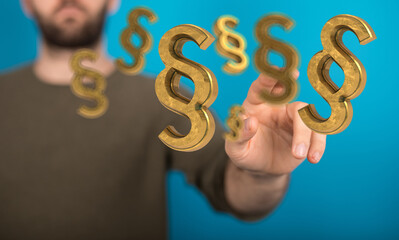 Hand hält Paragraphen Symbo