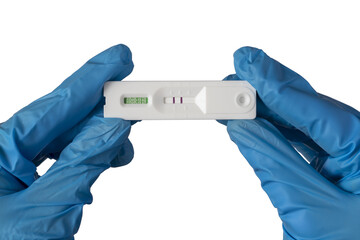 Doctor shows positive Covid-19 antigen test. Close-up.