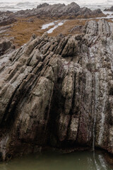 rocks on the coast of sopelana in the basque country